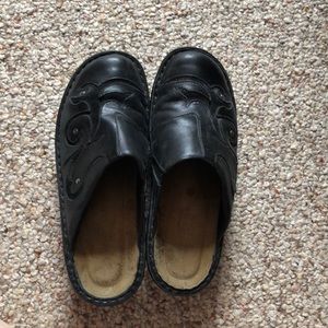 Black leather clogs